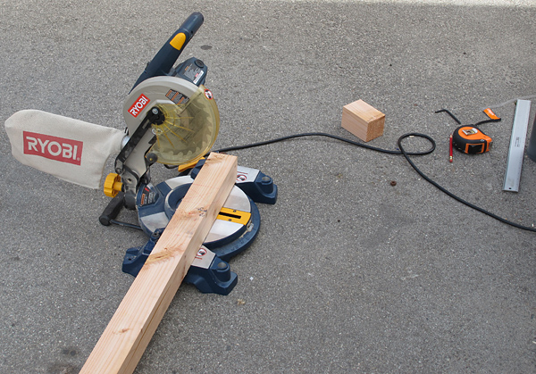 Chop-sawing the cedar beams on the floor of a parking lot