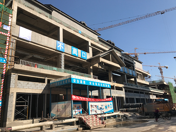 concrete building construction photo, mixed-use modern-traditional architecture project in Handan, China
