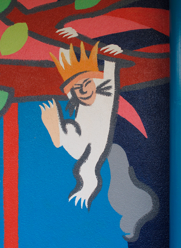 Storybook mural - Where the Wild Things Are boy swinging from tree - Kester Elementary in Van Nuys, CA