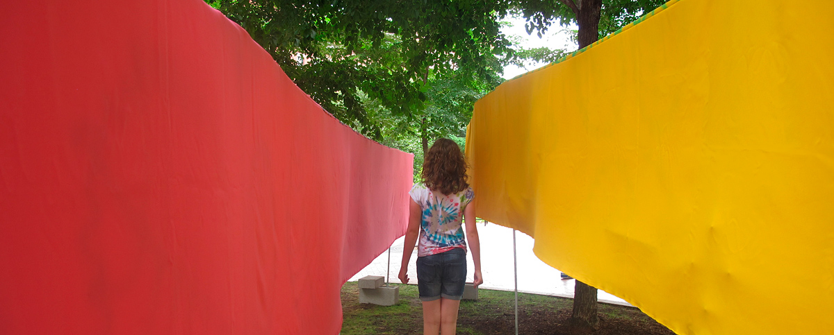girl in pink and yellow tunnel, Wharf District Parks, Boston