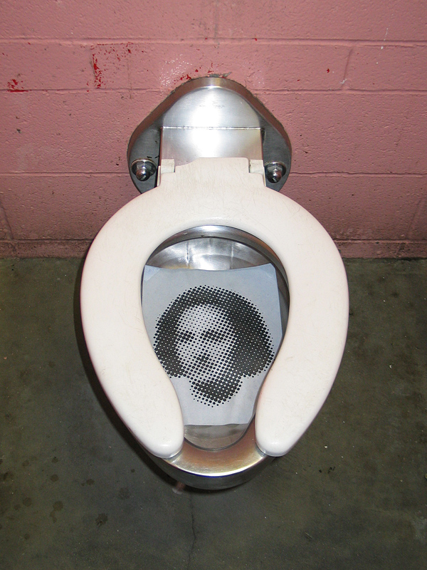 Caricature of Elena Ceausescu thrown in the toilet
