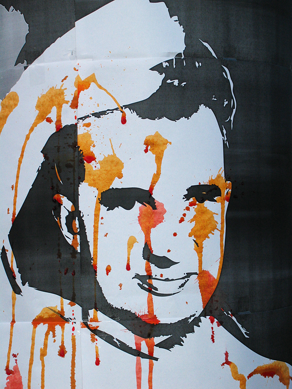 Detail of full scale print caricature of Nicolae Ceausescu shot with food coloring