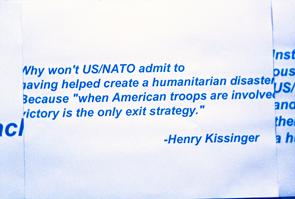War protest sheets with quote from Henry Kissinger