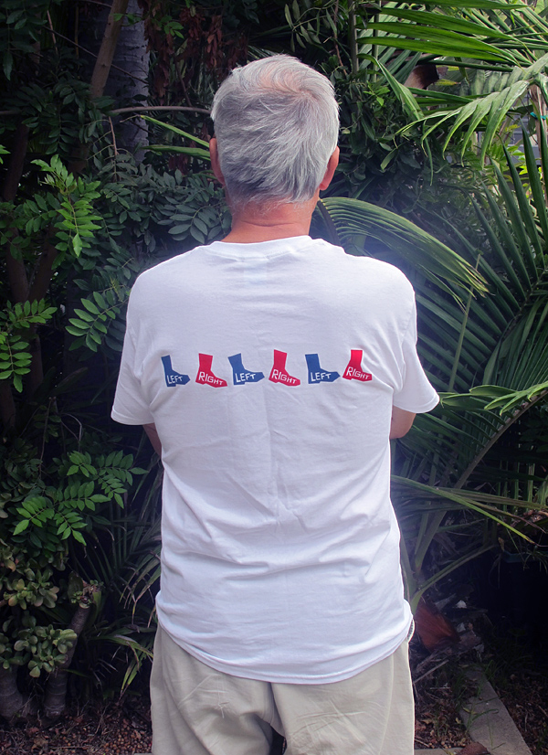Man wearing T-shirt with Left Right blue red boots marching, back side