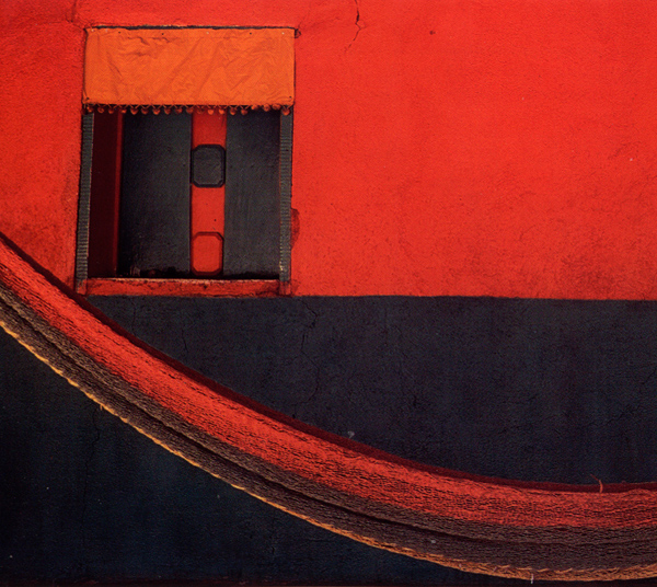small wooden door in village red and black wall, La Venta del Sur, Cholutec, Honduras, from Maya Color by Jefferey Becom, 1997